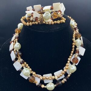 Neutral color triple strand beaded necklace/bracelet with silver tone accents